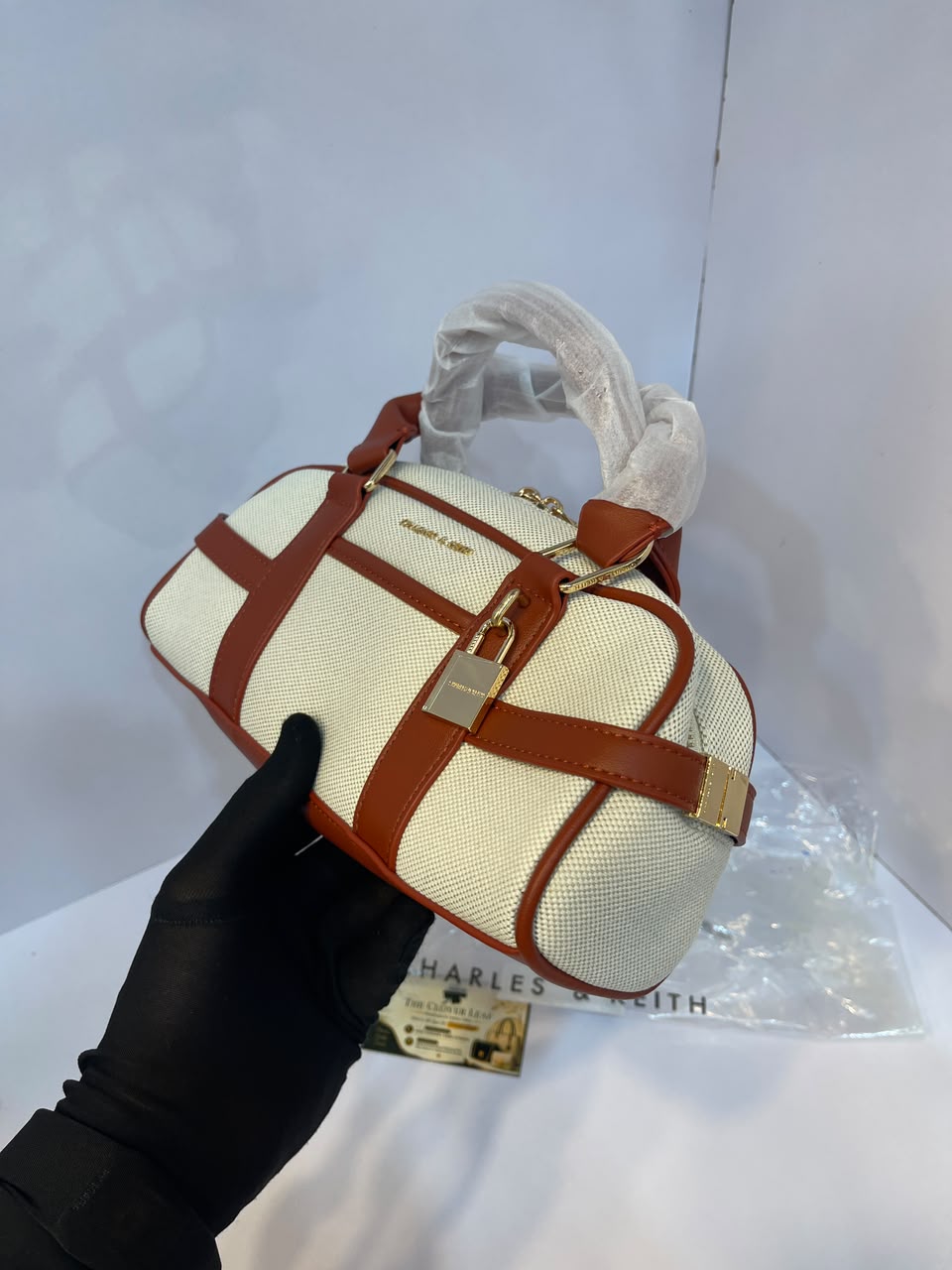 Charles & Keith Canvas Top-Handle Bowling Bag – Elegant Contrast Trim Crossbody Satchel