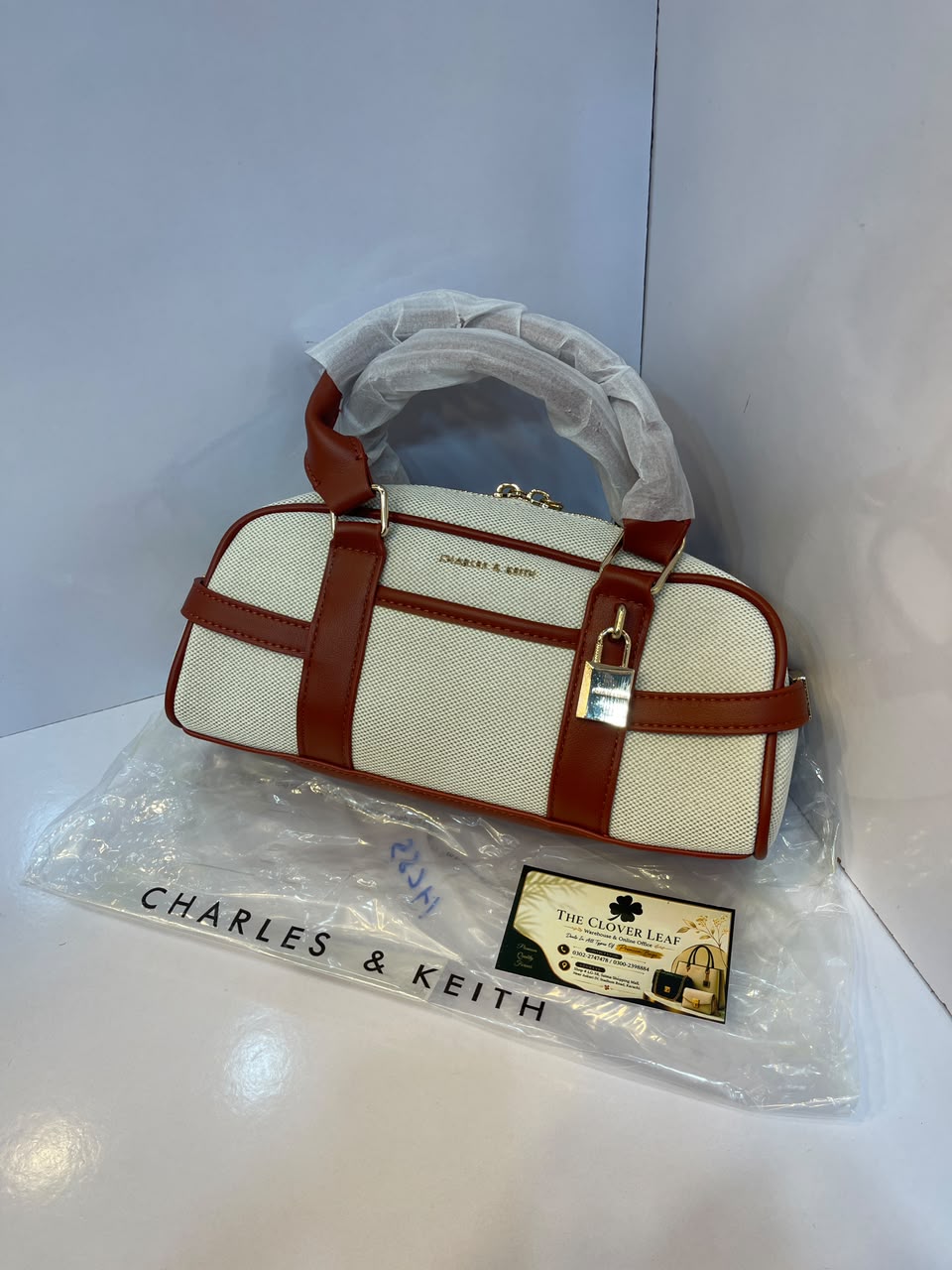 Charles & Keith Canvas Top-Handle Bowling Bag – Elegant Contrast Trim Crossbody Satchel