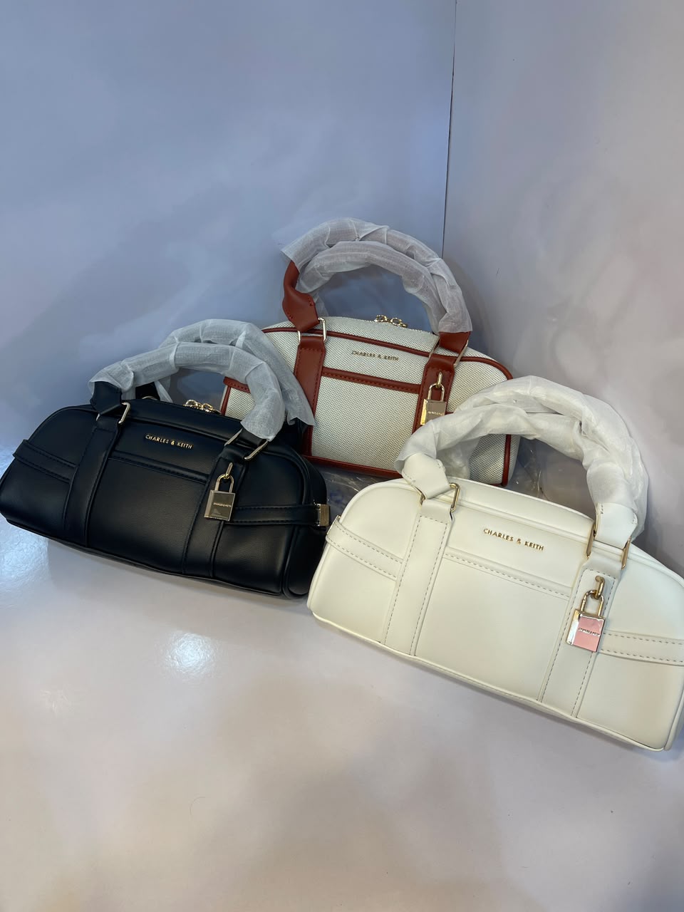 Charles & Keith Canvas Top-Handle Bowling Bag – Elegant Contrast Trim Crossbody Satchel