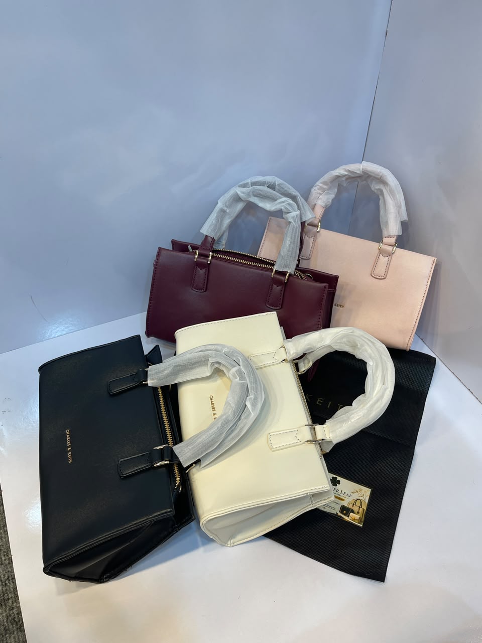 Charles & Keith Minimalist Matte Top-Handle Trapeze Bag – Premium Everyday Crossbody Satchel